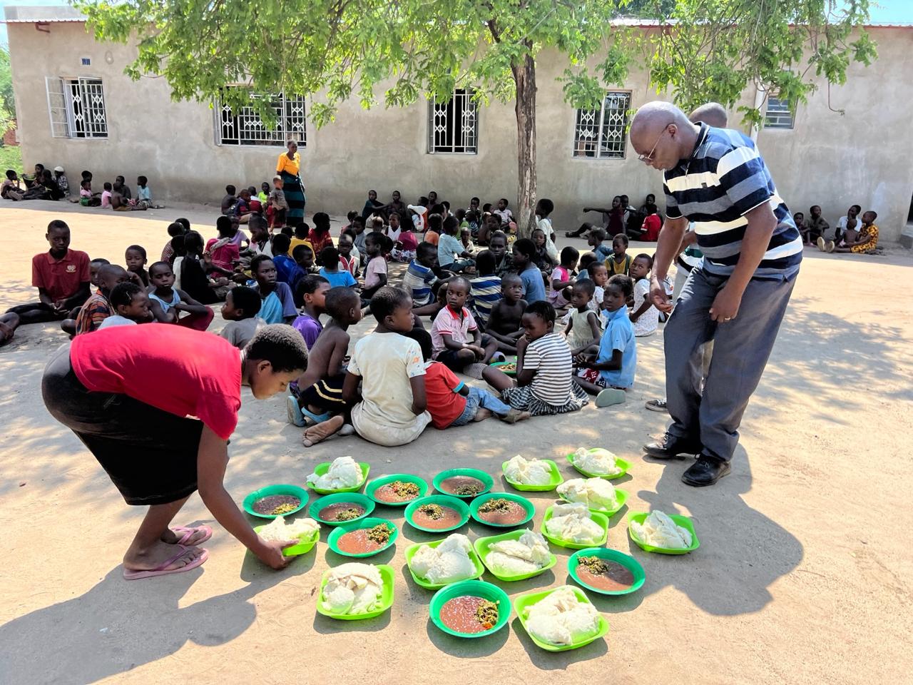 Students receiving nutritious meals through the daily feeding program